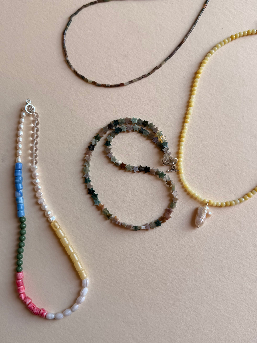 butter with pearl pendant