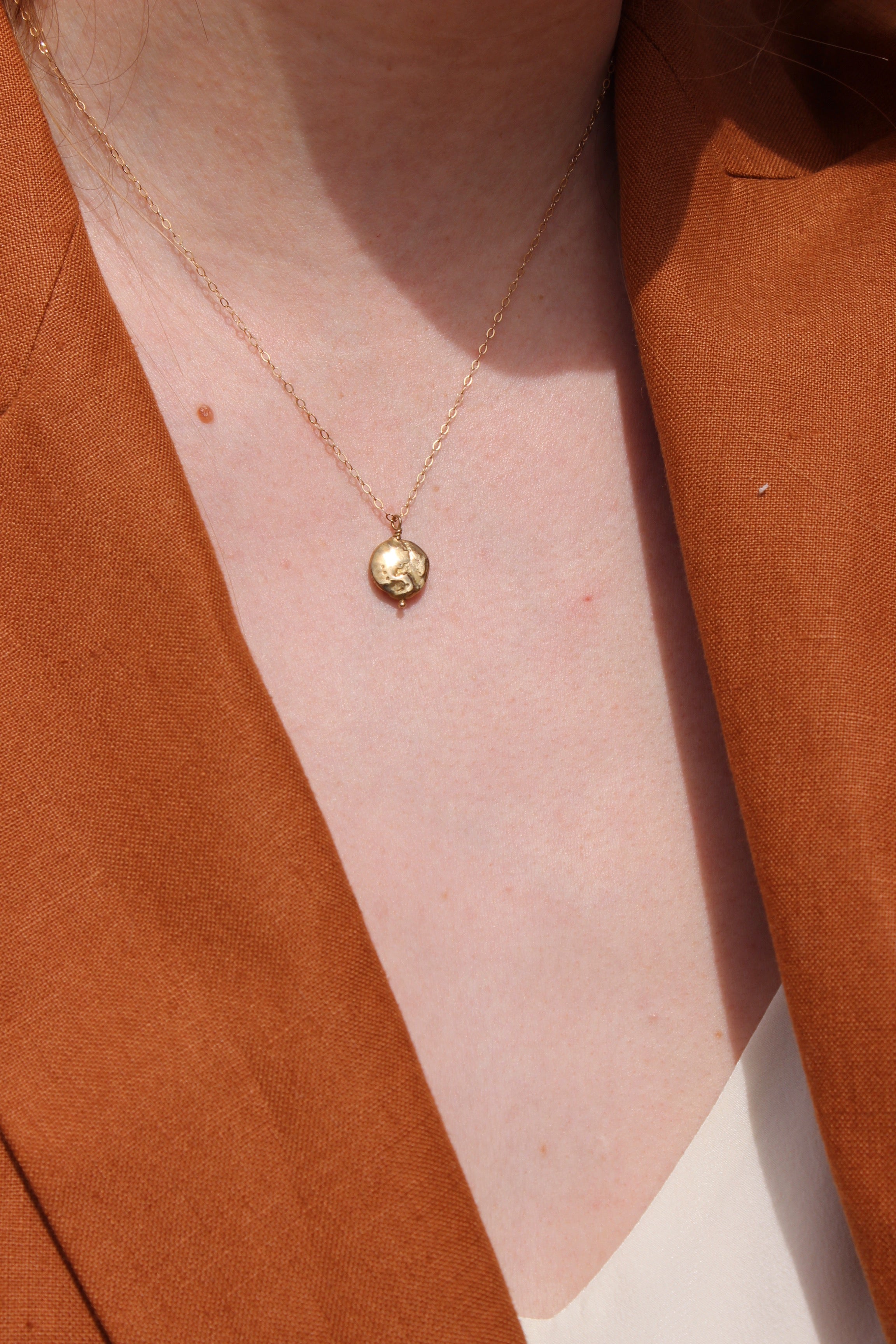 cast pearl medallion