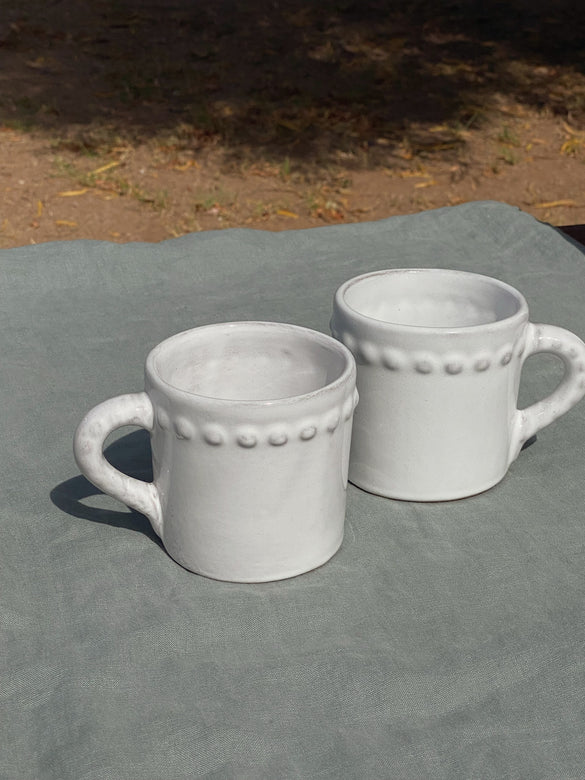 white terracotta mugs