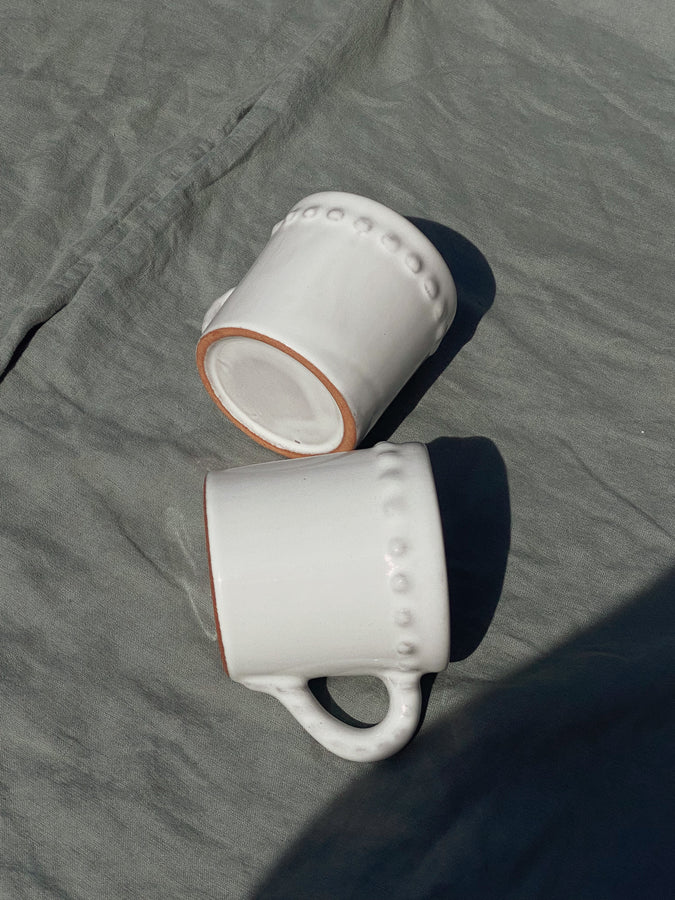white terracotta mugs